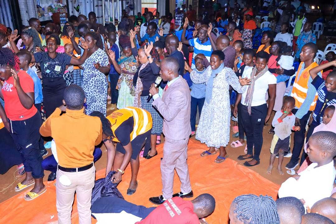 Children raising hands in worship - Triple Anointing Children Foundation